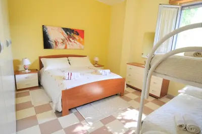 Letto o letti in una camera di Villa Felice Marzamemi