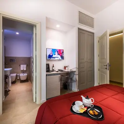 Letto o letti in una camera di Hotel Porta Reale