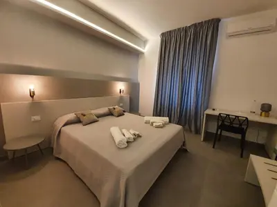Letto o letti in una camera di Charme Rooms Siracusa