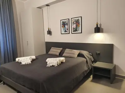 Letto o letti in una camera di Charme Rooms Siracusa