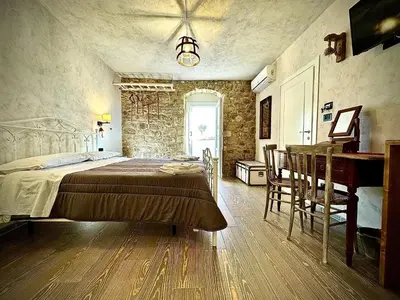 Letto o letti in una camera di Cuturissi Hospitality & Wellness