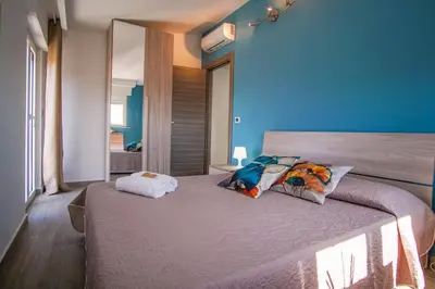 Letto o letti in una camera di Golf House - A few steps from the beach