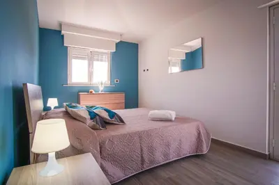 Letto o letti in una camera di Golf House - A few steps from the beach