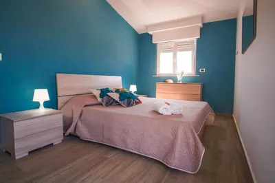 Letto o letti in una camera di Golf House - A few steps from the beach