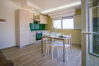 Cucina o angolo cottura di Laguna Blu Apartment - Panoramic View, Very close to the beach