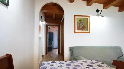 Letto o letti in una camera di Villa Pinuccia