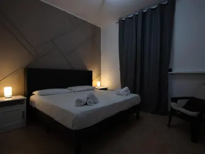 Letto o letti in una camera di Villa Pinuccia