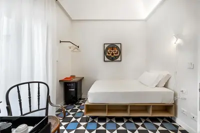 Letto o letti in una camera di A.D. 1768 Boutique Hotel