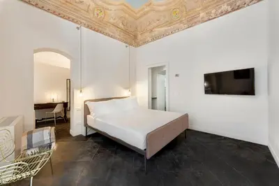 Letto o letti in una camera di A.D. 1768 Boutique Hotel