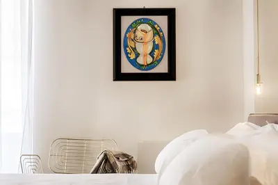 Letto o letti in una camera di A.D. 1768 Boutique Hotel