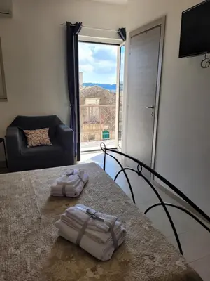 Letto o letti in una camera di Casa Alecci 1820