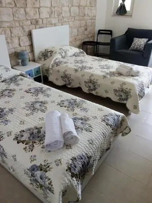 Letto o letti in una camera di Casa Alecci 1820