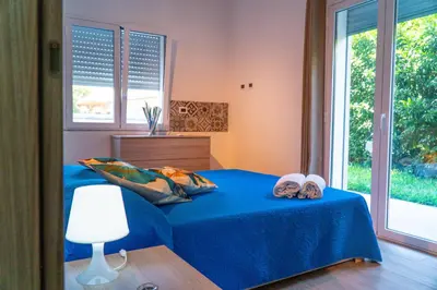 Letto o letti in una camera di Smeralda House - A few meters from the beach