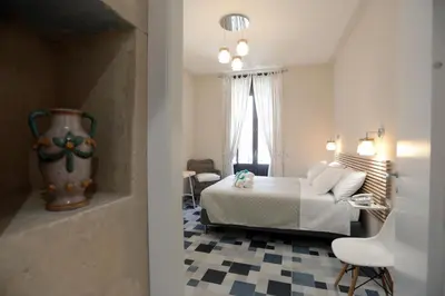 Letto o letti in una camera di Boutique House Anna Franzò