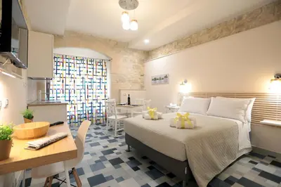 Letto o letti in una camera di Boutique House Anna Franzò