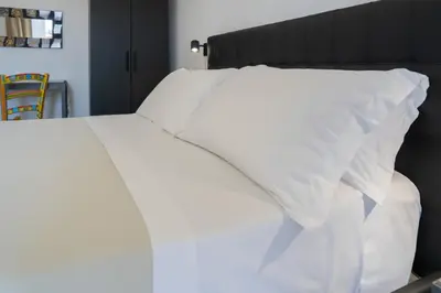 Letto o letti in una camera di Catania Over Time - Tourist Rooms