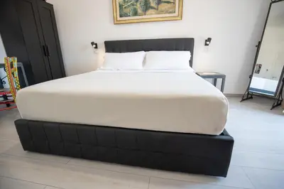 Letto o letti in una camera di Catania Over Time - Tourist Rooms