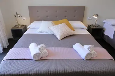 Letto o letti in una camera di Sunrise B&B Sicilia Avola