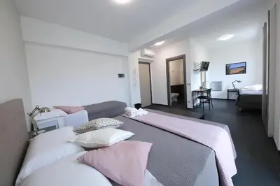 Letto o letti in una camera di Sunrise B&B Sicilia Avola