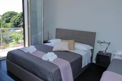 Letto o letti in una camera di Sunrise B&B Sicilia Avola