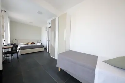 Letto o letti in una camera di Sunrise B&B Sicilia Avola
