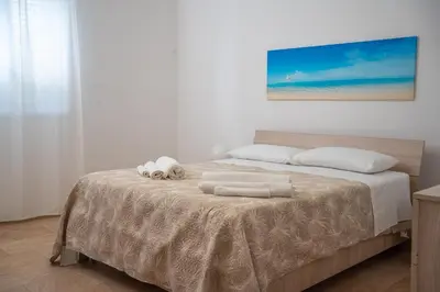 Letto o letti in una camera di Micalice's Sea House