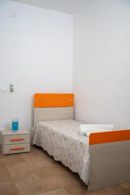 Letto o letti in una camera di Micalice's Sea House