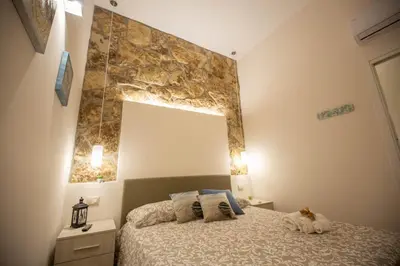 Letto o letti in una camera di Siracusa Houses K&S
