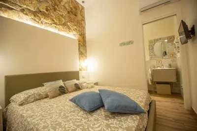Letto o letti in una camera di Siracusa Houses K&S