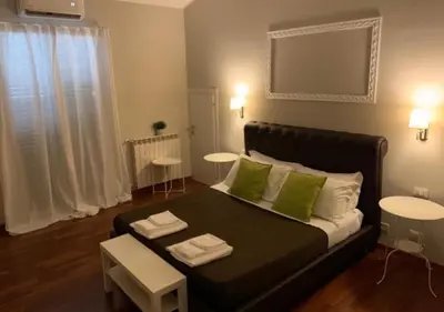 Letto o letti in una camera di BeB L'ALLORO