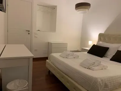 Letto o letti in una camera di BeB L'ALLORO
