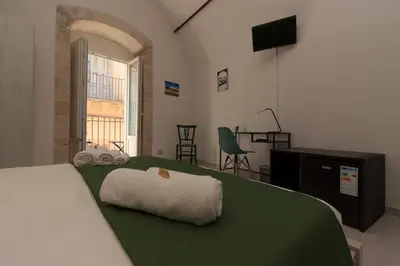 Letto o letti in una camera di Il sentiero dell'Itria - Camere con vista