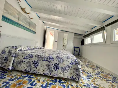 Letto o letti in una camera di Casa Campisi a 100 mt dal Mare Marzamemi
