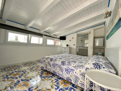 Letto o letti in una camera di Casa Campisi a 100 mt dal Mare Marzamemi