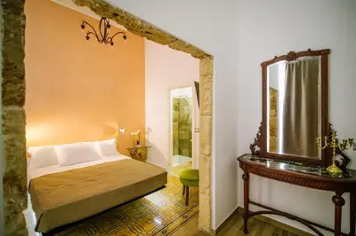Letto o letti in una camera di Regina Elena Rooms
