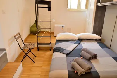 Letto o letti in una camera di Panoramic Suite***** in the heArt of Catania