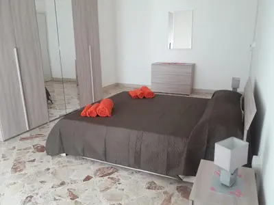 Letto o letti in una camera di Casa Angelica