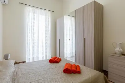 Letto o letti in una camera di Casa Angelica