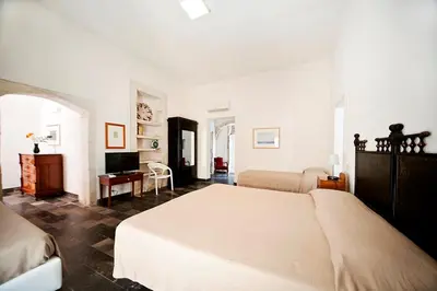 Letto o letti in una camera di Hotel Dell'Orologio