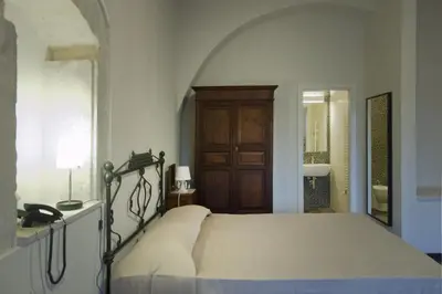 Letto o letti in una camera di Hotel Dell'Orologio