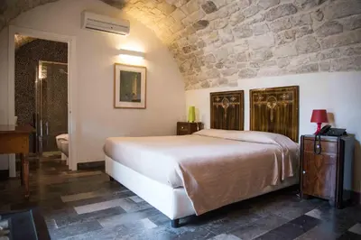 Letto o letti in una camera di Hotel Dell'Orologio