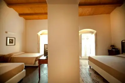 Letto o letti in una camera di Hotel Dell'Orologio