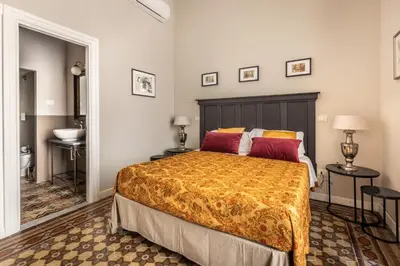 Letto o letti in una camera di Donna Maddalena