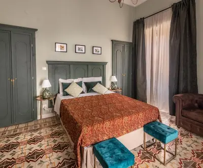 Letto o letti in una camera di Donna Maddalena