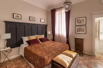 Letto o letti in una camera di Donna Maddalena