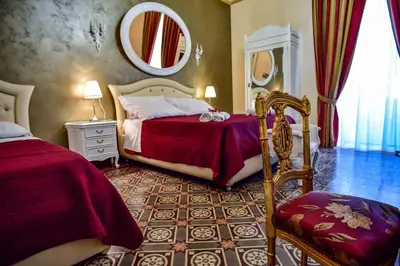 Letto o letti in una camera di Palazzo degli Affreschi