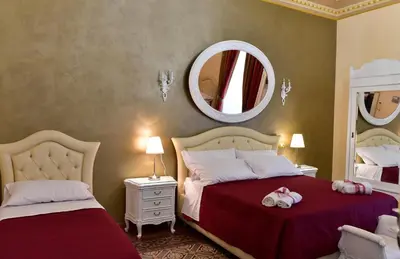 Letto o letti in una camera di Palazzo degli Affreschi