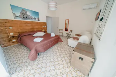 Letto o letti in una camera di SyracuseApartments il mare di Ortigia