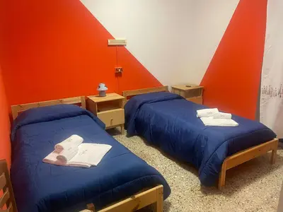 Letto o letti in una camera di Beteyà Hostel Don Bosco