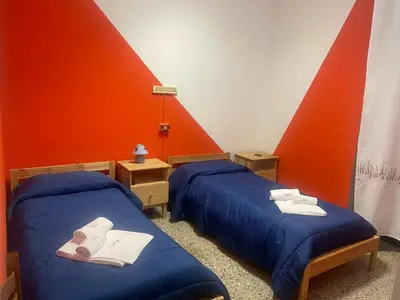 Letto o letti in una camera di Beteyà Hostel Don Bosco